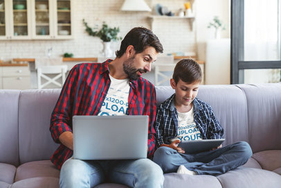 Heather T-Shirt Mockup of a Man and His Son Playing Games Together