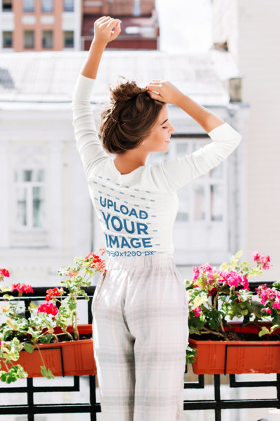 Back View Long Sleeve Tee Mockup Featuring a Woman on a Balcony m12460 r-el2
