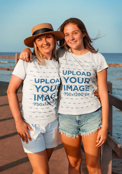 T-Shirt Mockup of a Mom Hugging Her Teenage Daughter at the Beach