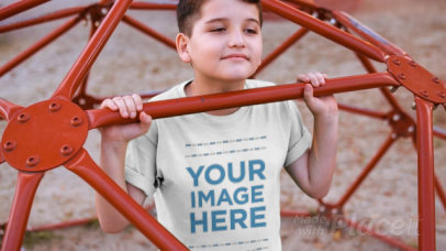 Boy Playing at the Jungle Gym Wearing a Round Neck Tee Video Mockup