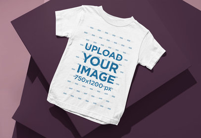 Mockup of a Bella Canvas Round-Neck T-Shirt for Kids Flat Laid over a Pile of Boxes m13444