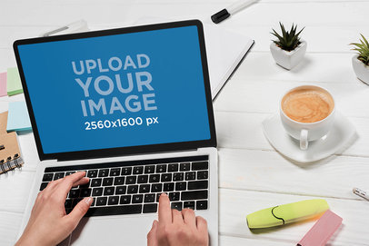 Mockup of the Hands of a Woman Working on a MacBook