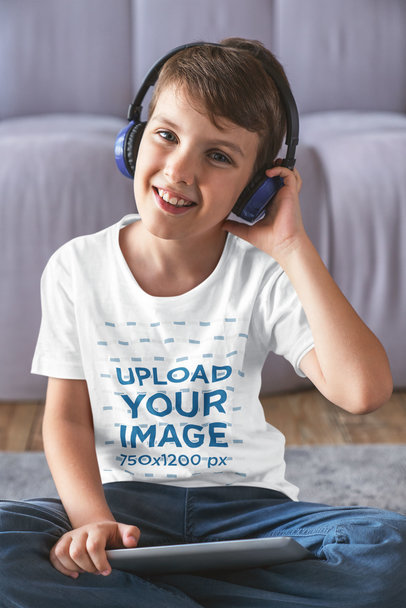T-Shirt Mockup Featuring a Smiling Boy with Headphones
