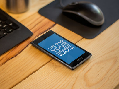 Mockup of an LG Optimus L7 on a Wooden Office Desk
