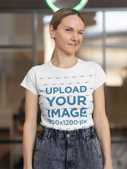 T-Shirt Mockup of a Woman Winking Toward the Camera