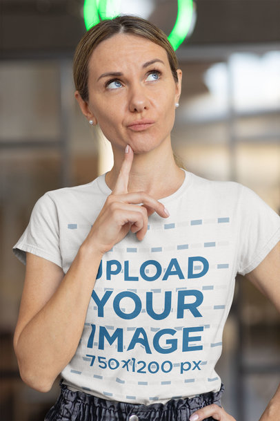 T-Shirt Mockup Featuring a Thoughtful Woman Looking Up