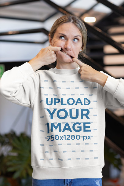 Mockup of a Woman Wearing a Sweatshirt and Making a Funny Expression