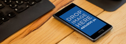 Mockup of an LG Optimus L7 over a Wooden Surface