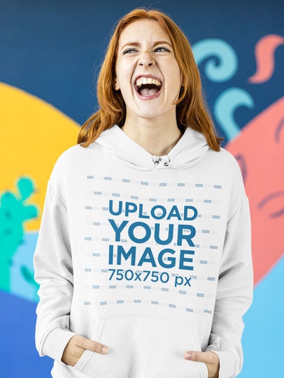 Fun Mockup of a Woman Making a Crazy Face while Wearing a Hoodie