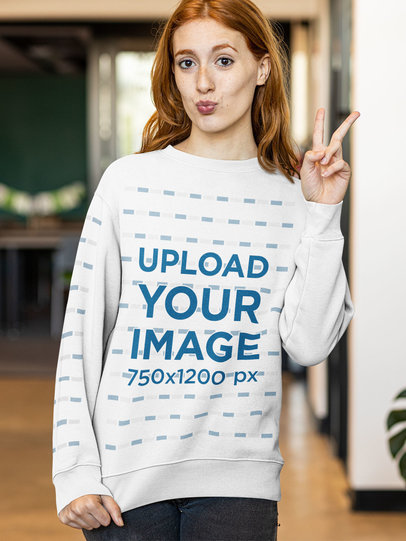 Sweatshirt Mockup of a Young Woman Posing While Making a Peace Sign