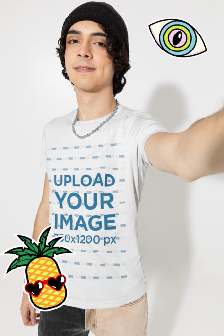 T-Shirt Mockup of a Young Man Taking a Selfie Featuring Sticker Graphics