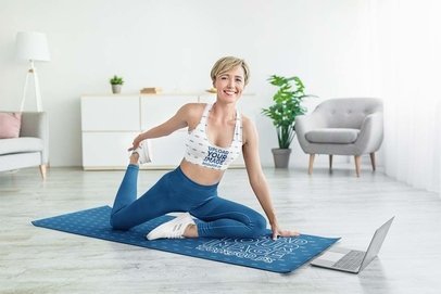 Sports Bra and Yoga Mat Mockup Featuring a Happy Woman Stretching