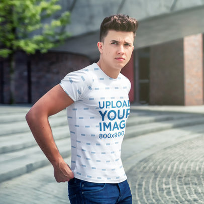 Sublimated T-Shirt Mockup Featuring a Serious Man Walking in the Street