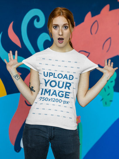 T-Shirt Mockup of a Tattooed Woman Making a Surprised Expression