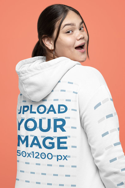 Back-View Hoodie Mockup with Customizable Sleeves Featuring a Woman Making a Surprised Expression 