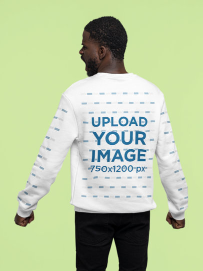 Back-View Mockup of a Man Wearing a Sweatshirt With Customizable Sleeves at a Studio