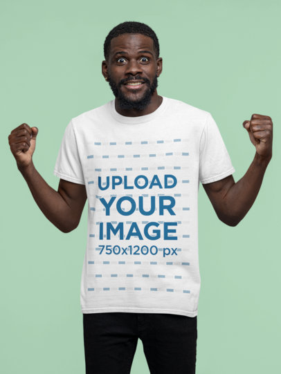 T-Shirt Mockup Featuring an Excited Man with his Fists Up