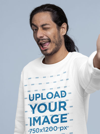 Sweatshirt Mockup Featuring a Man Winking While Taking a Selfie m22449