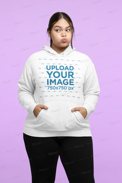 Mockup of a Woman Wearing a Plus-Size Hoodie While Making a Funny Expression