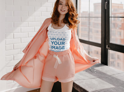 Tank Top Mockup Featuring a Woman Wearing Pajamas in Her Apartment
