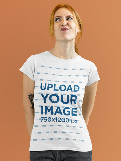 T-Shirt Mockup of a Red-Haired Woman Making a Face