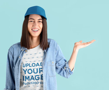 T-Shirt Mockup of a Happy Woman Showing Something with Her Hand