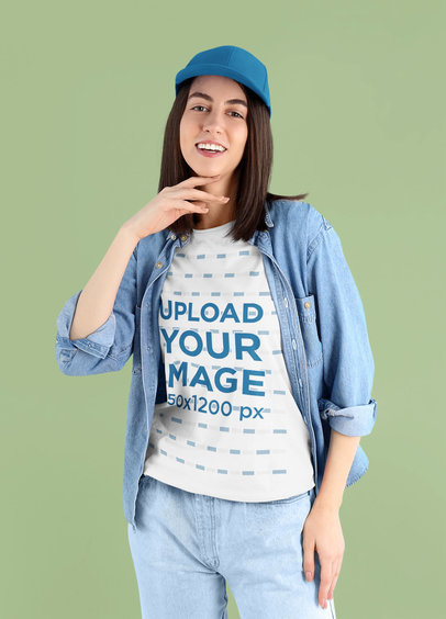 T-Shirt Mockup of a Young Woman Posing with a Denim Outfit in a Studio