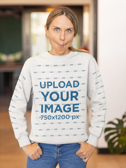 Mockup of a Woman Doing a Funny Face While Wearing a Sweatshirt With Customizable Sleeves
