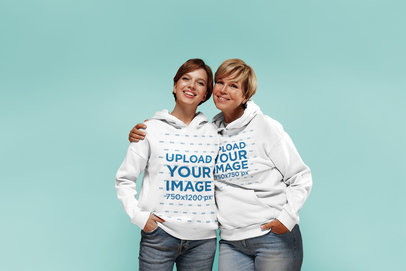 Hoodie Mockup of Mother and Daughter Posing Together in a Studio
