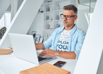 Round-Neck Tee Mockup of a Man with Glasses Working at the Office m17128 r-el2