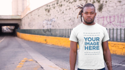Mockup of a Young  Man with Locks Standing at an Underpass Wearing a Tshirt Video Mockup a12235