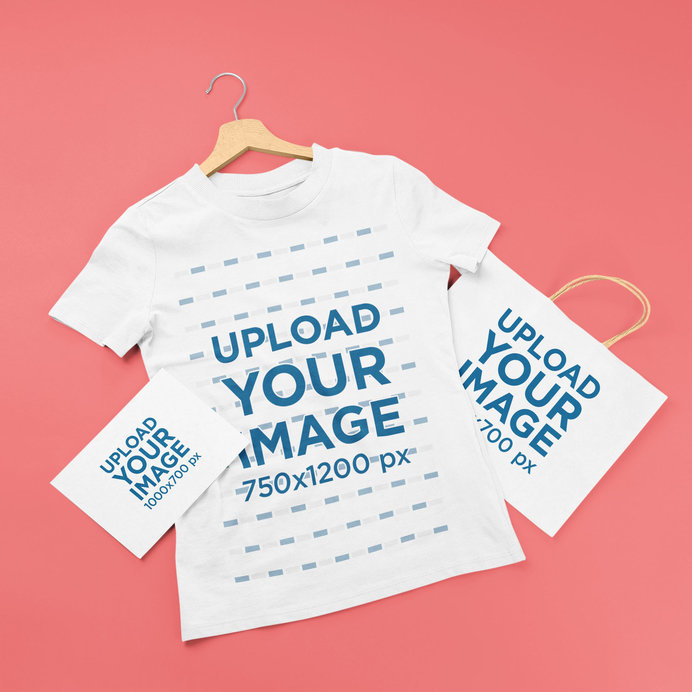 Mockup of a T-Shirt on a Hanger Placed Next to a Greeting Card and a Shopping Bag