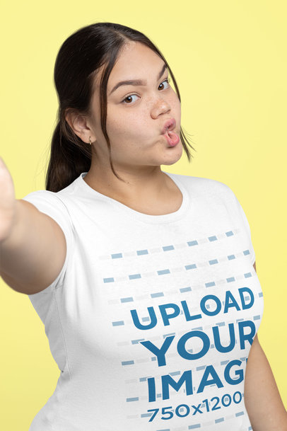 T-Shirt Mockup of a Woman Taking a Selfie with a Duckface