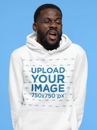 Hoodie Mockup Featuring a Bearded Man Yawning at a Studio