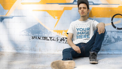 Skater Guy Sitting at the Skate Park Wearing a Round Neck Tee Video Mockup
