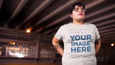 Young Woman with Glasses Out in the City Wearing a Plus Size Tshirt Video Mockup a12650