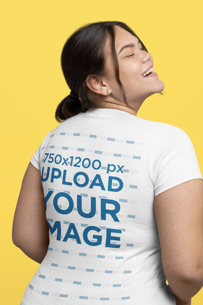 Back-View Mockup of a Happy Woman Wearing a Plus-Size T-Shirt in a Studio