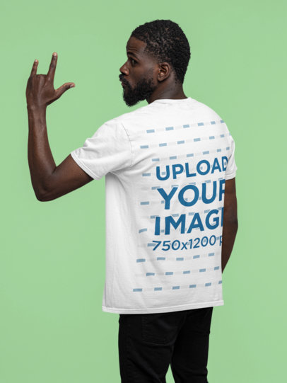 Back View T-Shirt Mockup of a Man Doing the Rock and Roll Sign with his Hand
