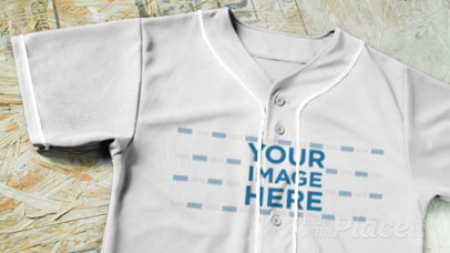 Baseball Uniform Builder - Jersey Lying on a Wooden Floor