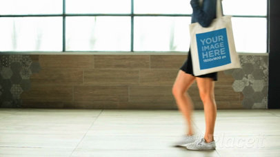 Girl Walking Near A Window Holding a Tote Bag Video a13719