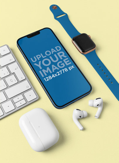 Mockup of an iPhone 13 Featuring other Apple Devices