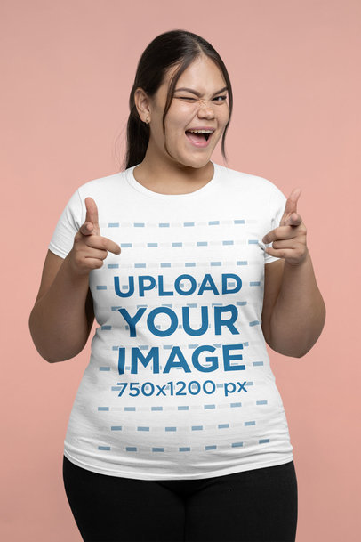 T-Shirt Mockup Featuring a Brunette Woman Winking to the Camera