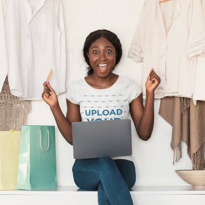 T-Shirt Mockup Featuring an Excited Woman Holding a Credit Car m16394 r-el2