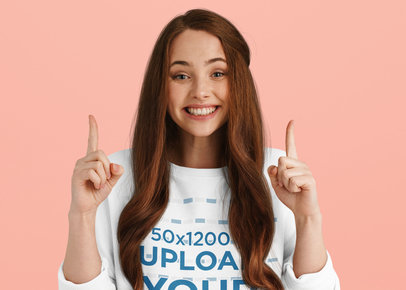 Sweatshirt Mockup of a Happy Long-Haired Woman Pointing Up 