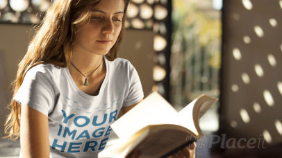 Girl Wearing a Round Neck Tee Holding a Book with Moving Pages in Stop Motion a13319