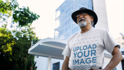 Senior Man Wearing a Round Neck Tshirt Video and a Hat while in the City
