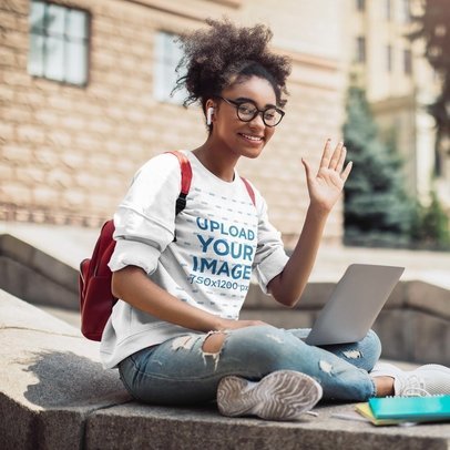 Mockup of a College Woman Student Wearing a Sweatshirt While Waving to the Camera