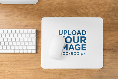 Mockup Featuring a Mousepad on a Rustic Wooden Desk