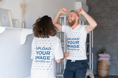 T-Shirt Mockup Featuring a Man and a Woman Celebrating and Jumping at Home m19063-r-el2