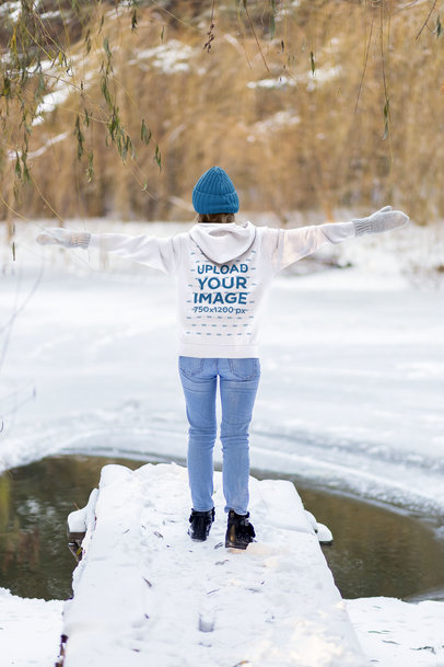 Back View Hoodie Mockup of a Woman Standing Near a Frozen Pond m20802-r-el2